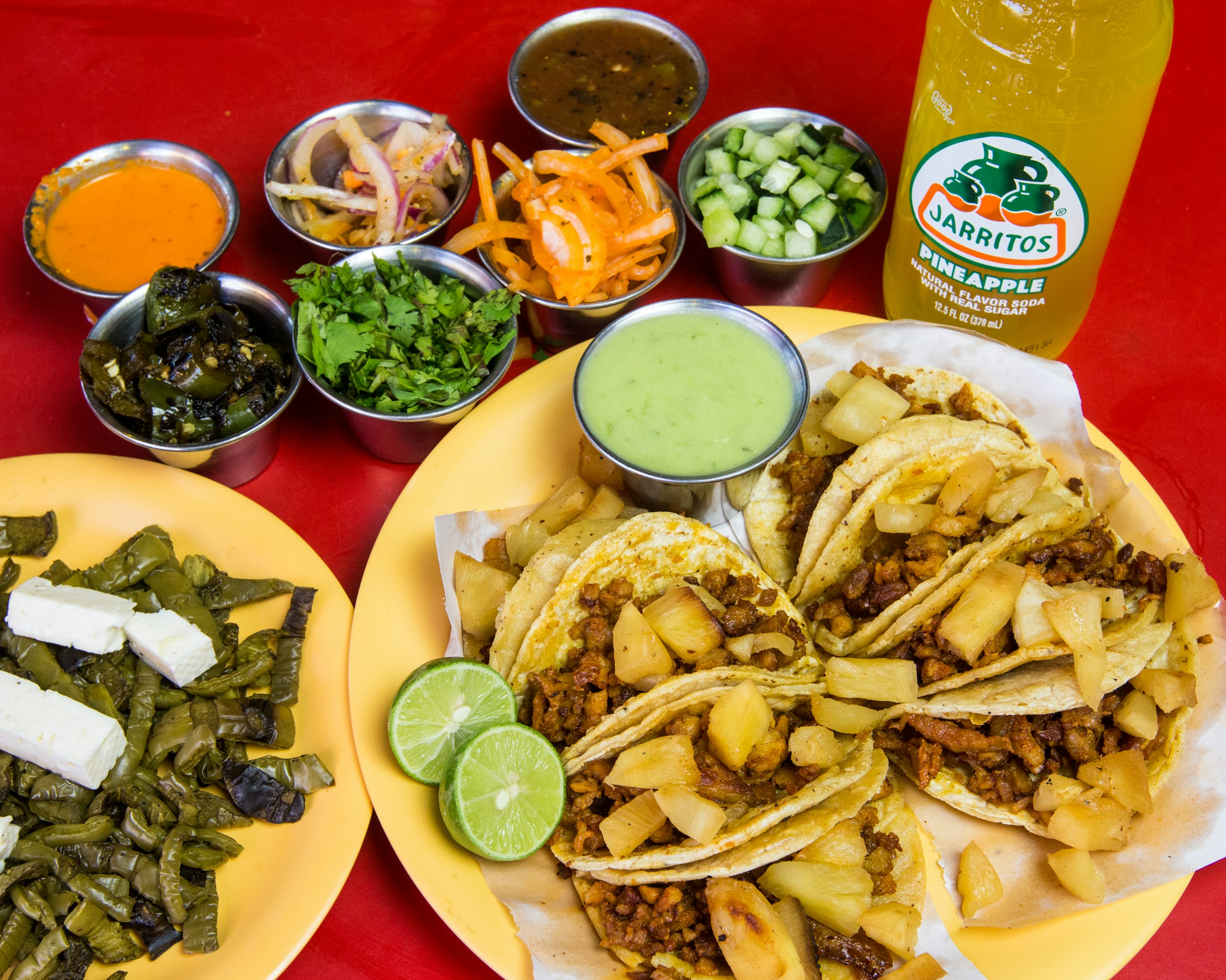 Tacos al pastor with grilled nopales and a pineapple Jarritos soda