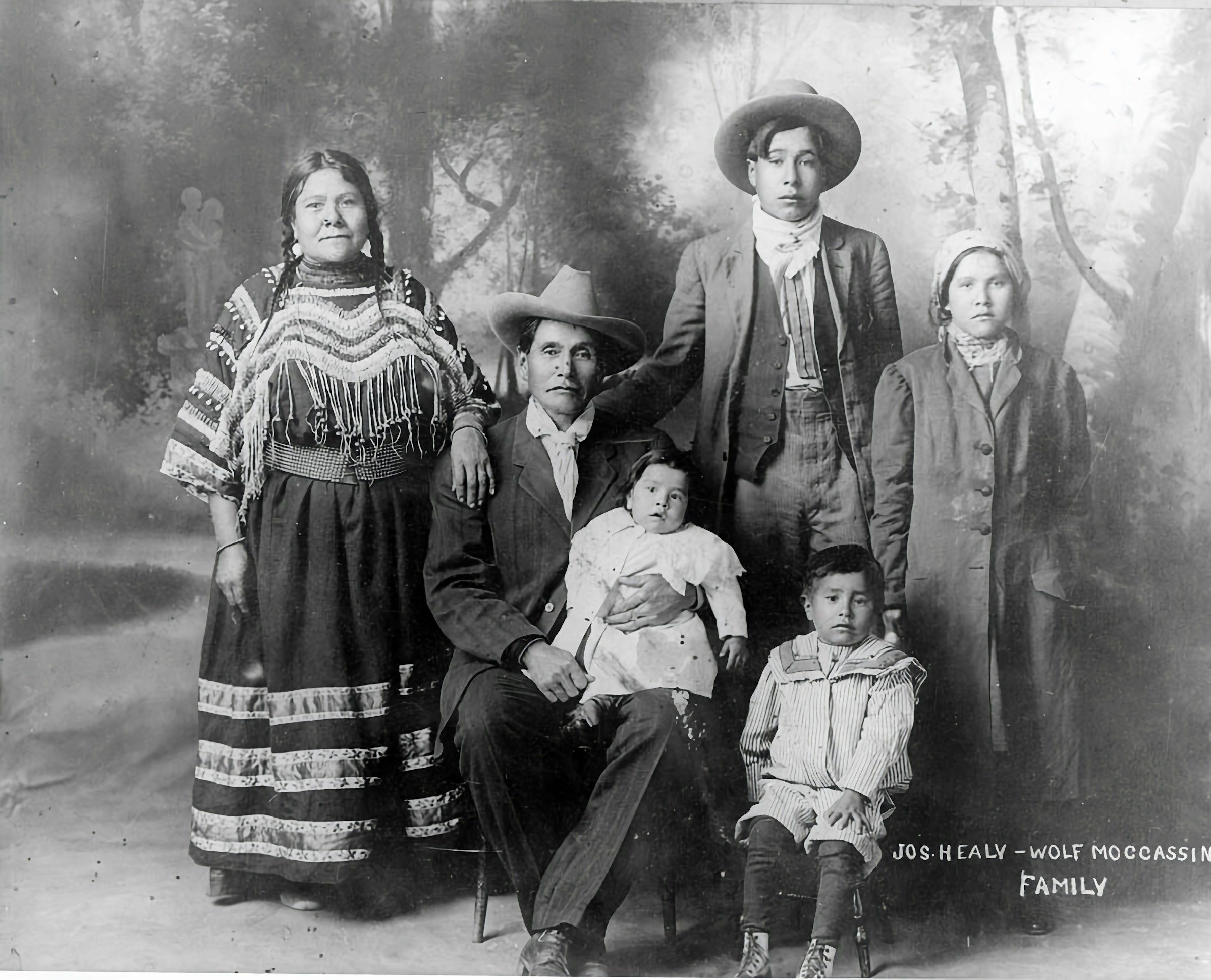 A framed family photograph on the wall of the dining room.
